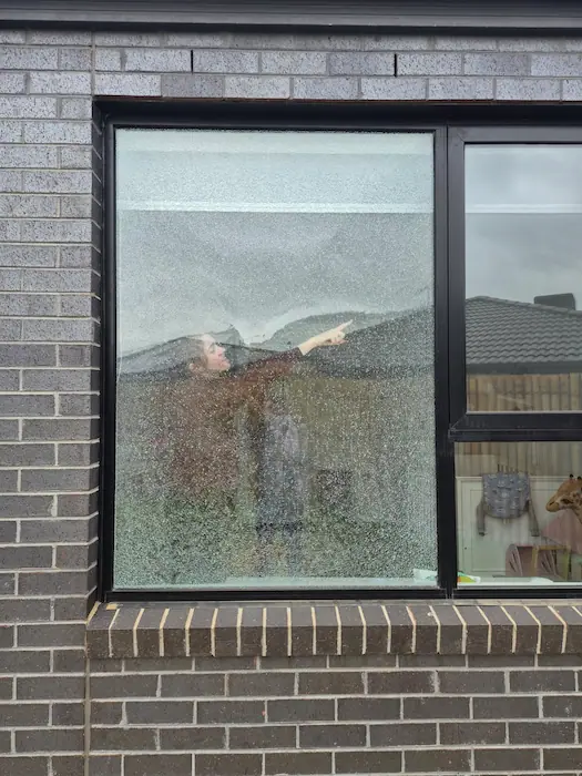 Broken window glass photographed for a home insurance claim in Melbourne